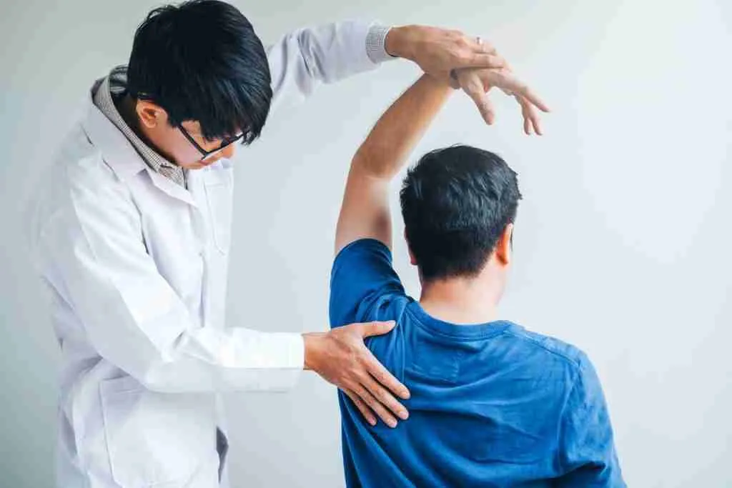 Shoulder Pain And Instability: When To See A Shoulder Specialist In Singapore 1 Orthopaedic Shoulder Specialist Assessing Shoulder Pain And Movement In A Patient At A Singapore Clinic